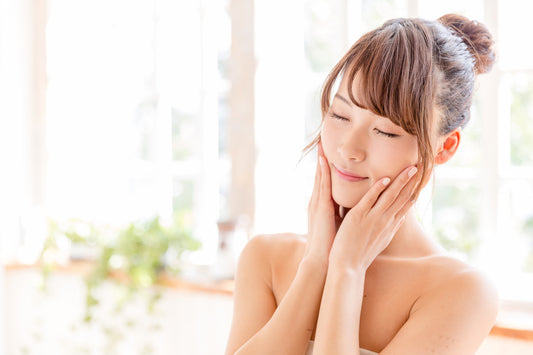 woman touching skin in the day